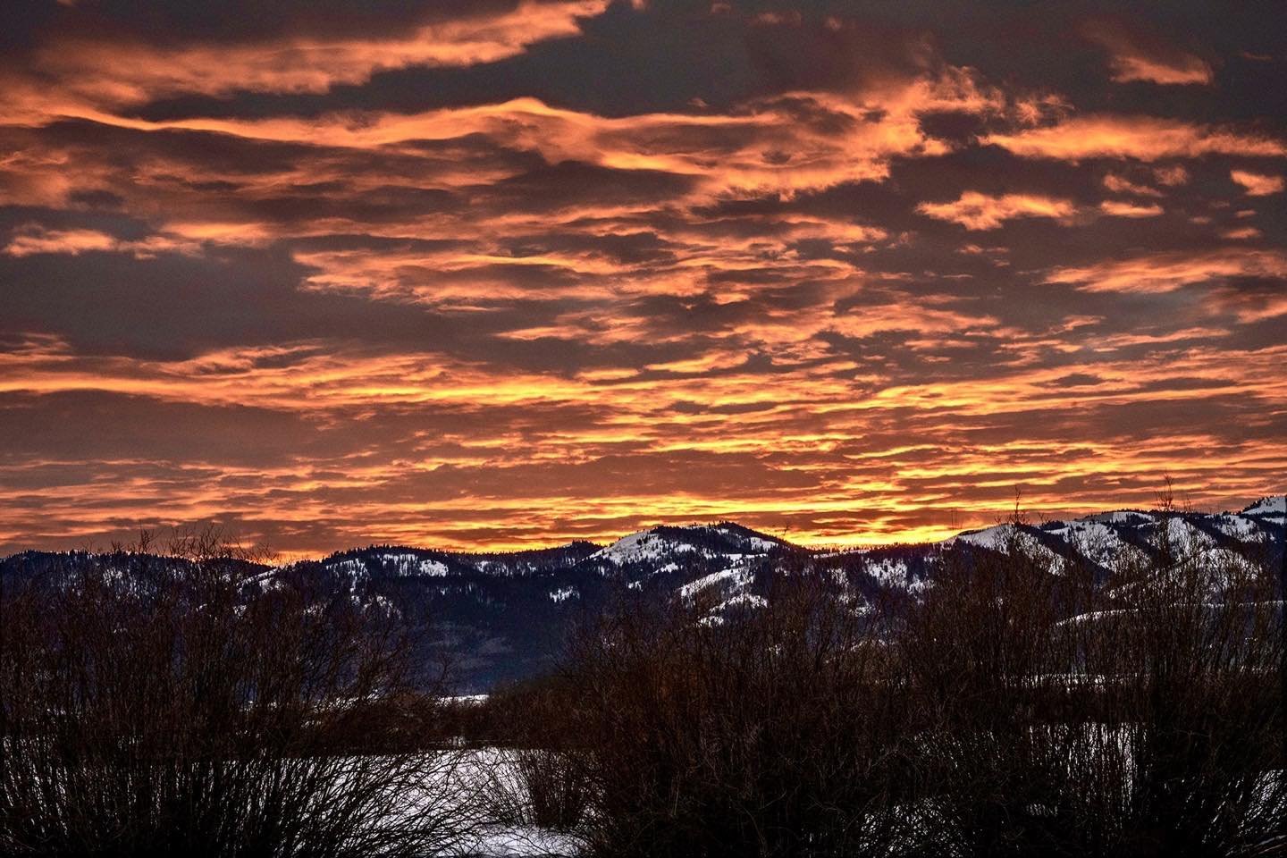 Exciting sunset over the Big Hole Mountains on the west side of Teton Valley in Victor, Idaho last evening. Layer upon layer of edge lit clouds provided this show-stopper at the end of an unusually warm first day of February. #tetonvalleyidaho #bigholemountains #orcuttphotography #bestofthegemstate #victoridaho #westernsunset
