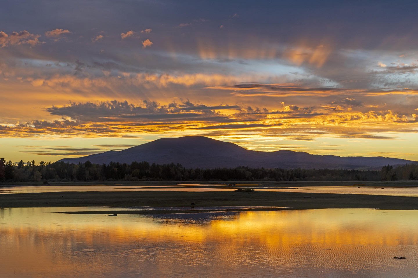East Kennebago Mountain at sunset from the causeway north of Stratton, Maine. #eastkennebagomountain #strattonmaine #flagstafflake #orcuttphotography #sunsetmaine