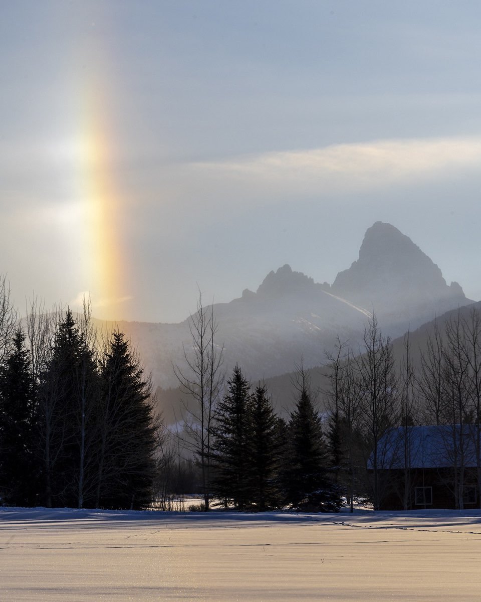 Early this morning this vertical rainbow appeared in our backyard in Driggs, Idaho. Our guess was that there must have been a snow layer close to the mountains, though there was no evidence of snow falling near us. #rainbowatdriggsidaho #bestofthegemstate #tetoncanyonidaho #orcuttphotography #tetonmountains