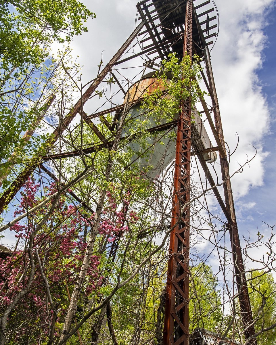 Historic sawdust collector in New Vineyard, Maine just as you enter the village heading north. Our kids referred to it as a giant frosting dropper! A unique skyline tower marking a chapter in the history of the village. #newvineyardmaine #historicsawdustcollector #skylinetower #orcuttphotography #historicmaine #historicstructuresofmaine