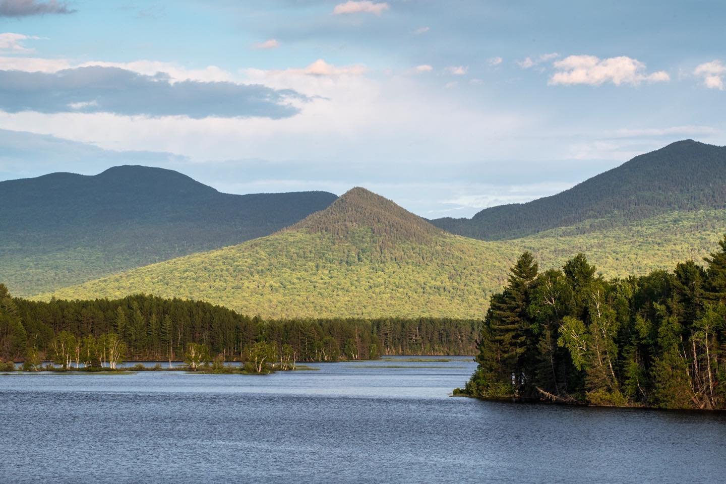 East Nubble photographed from the Pines Market in Eustis, Maine. It’s conical shape was outlined by the dark shapes of the Bigelow Range last evening. We waited for the cloud-directed fading sunlight to separate the foreground shape from its background. #pinesmarket #eustismaine #eastnubble #bigelowrange #approachingthelongestday #orcuttphotography
