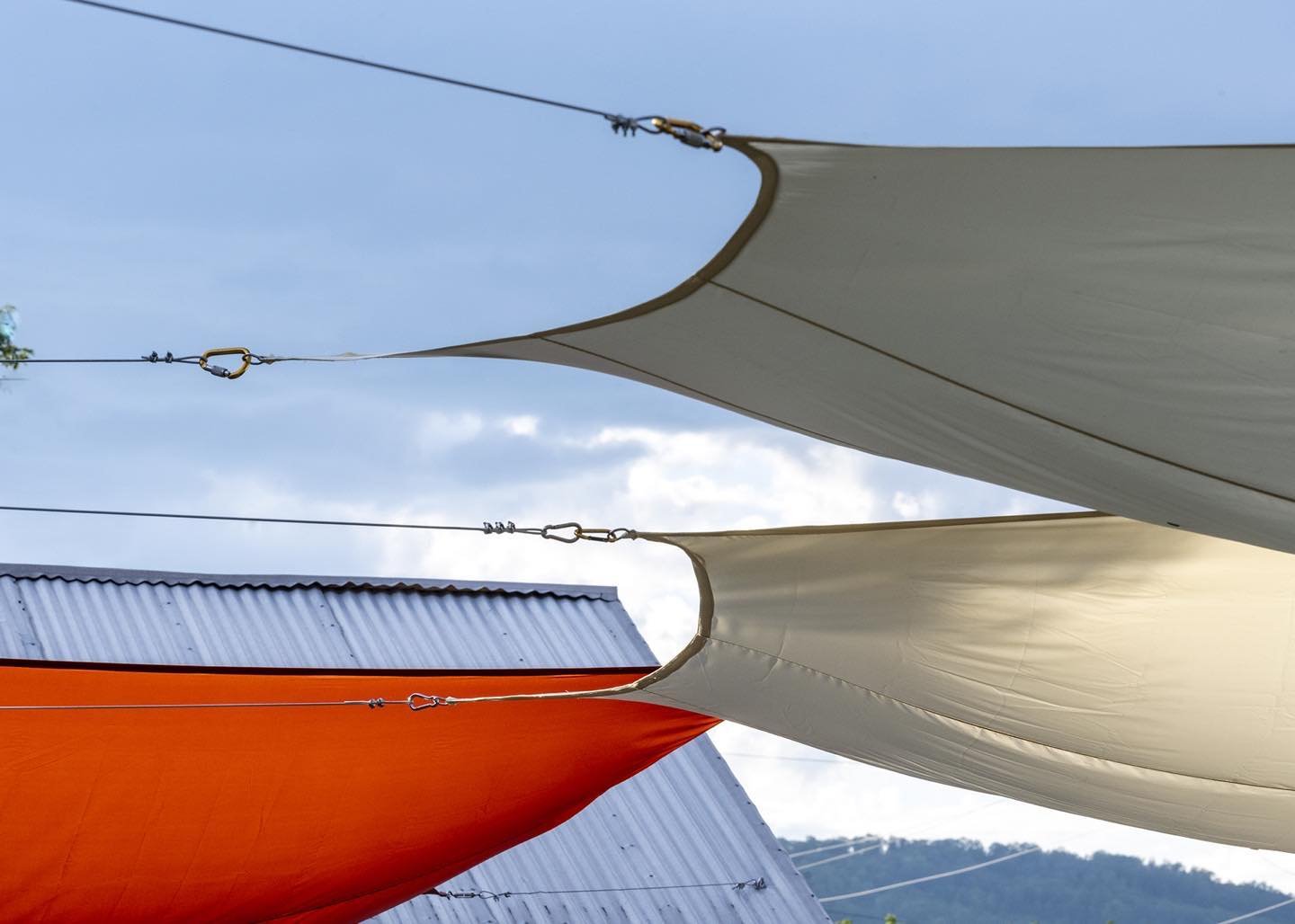 Sun screens at Rolling Fatties provide strong sculptural forms against the Western Maine sky. #rollingfatties #kingfieldmaine #orcuttphotography #sunscreens