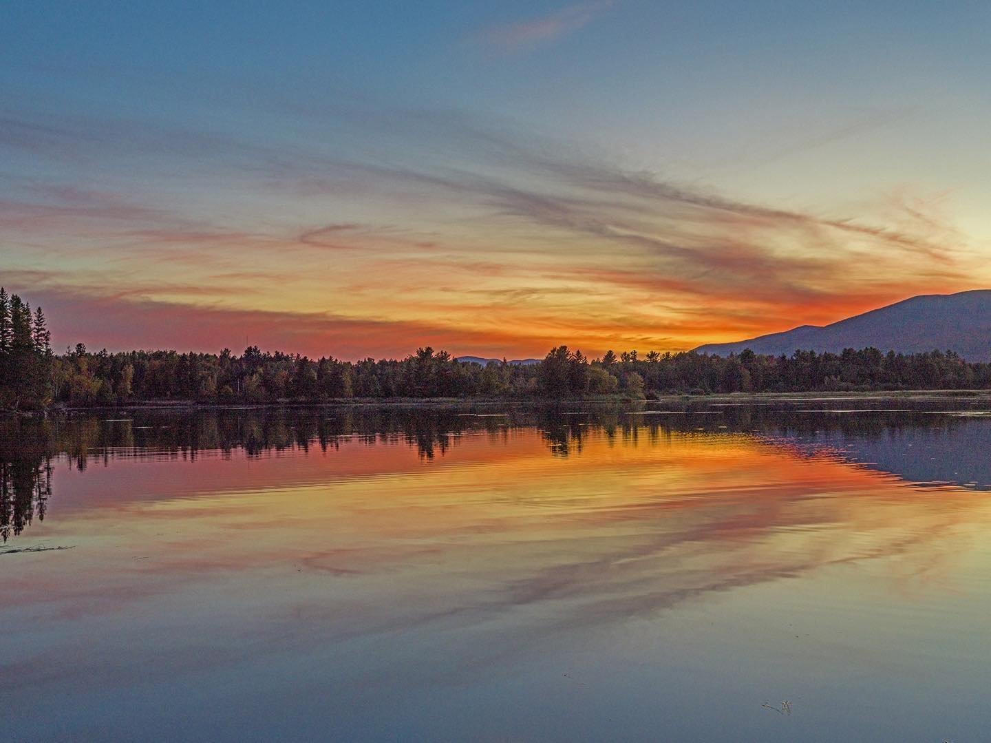 Sunset at Flagstaff Lake a few weeks ago. The light at this time of year always seems to emphasize color in the sky, foliage and water more than at any other time. #flagstafflakemaine #strattonesustismaine #autumnsky #orcuttphotography