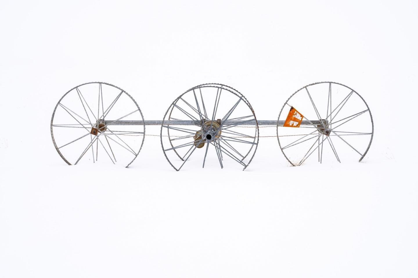 Wheel Line Art from eastern Idaho, Teton Valley during a white-out. When the background is obscured, these irrigation devices are sculptures on the landscape! #wheellineart #bestofthegemstate #tetonvalleyidaho #driggsidaho #orcuttphotography.danstpeter.com #newwork