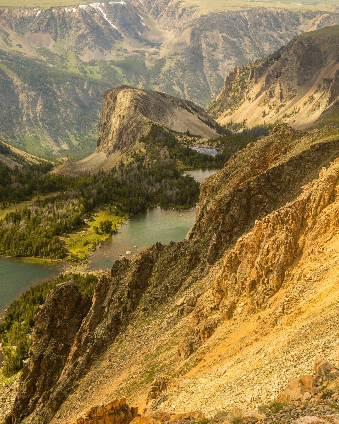 We drove over Beartooth Pass from Red Lodge to Cooke City in southern Montana last week. Views in every direction were breath-taking. The summit is at 10,947 in an alpine meadow with dramatic high mountain valleys and lakes carved into it. #beartoothpassmontana #rockymountainphotography #redlodgemontana #cookecitymontana #northeastentrancetoyellowstone #atorcuttphotography