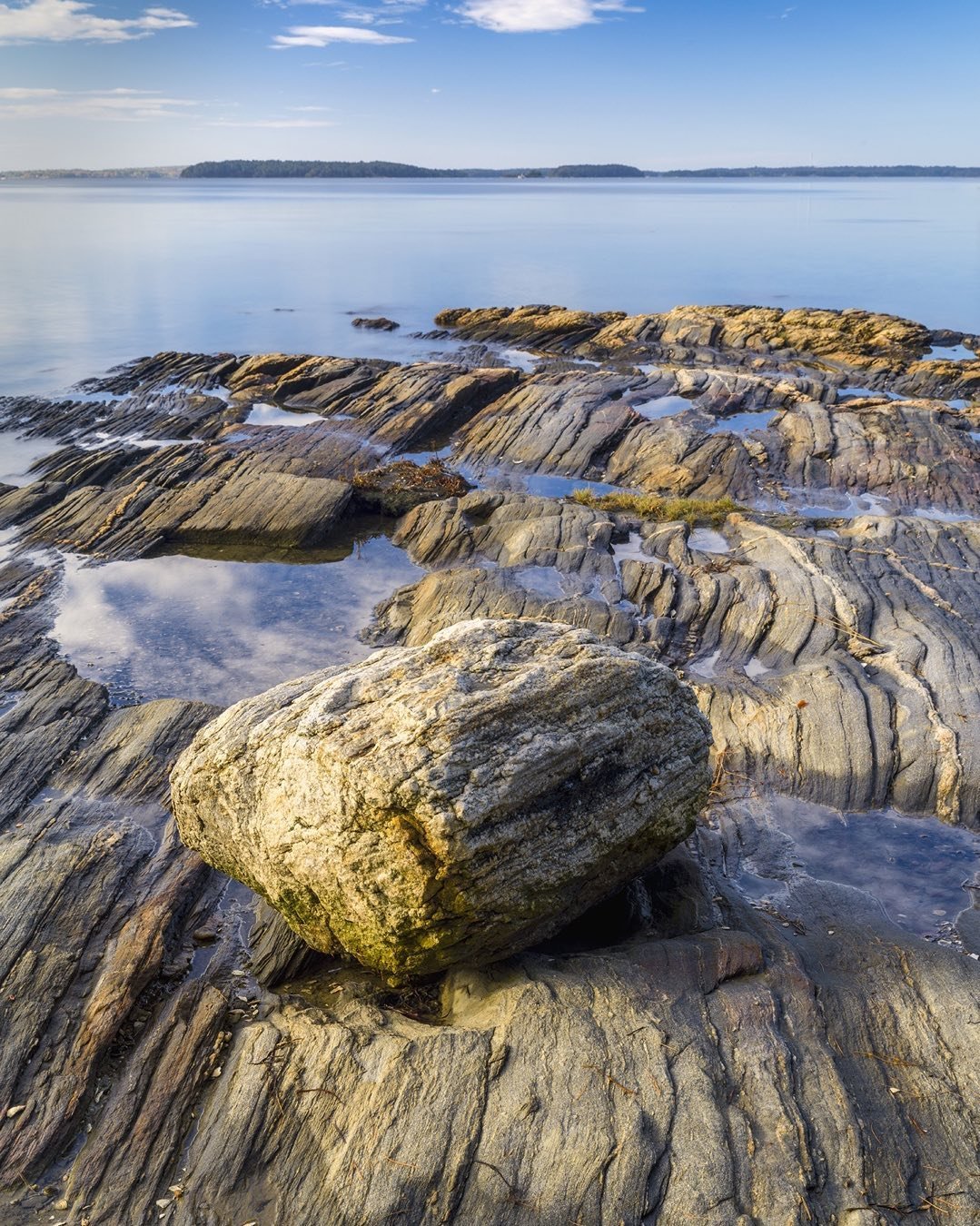 We call this Lone Rock at Wolfes Neck in Freeport, Maine. Probably an erratic carried and deposited at the end of the last ice age, 12,000 to 13,000 years ago on the eroded bedrock. #freeportmaine #lonerock #erraticrock #wolfesneckcampground #wolfesneckstatepark
